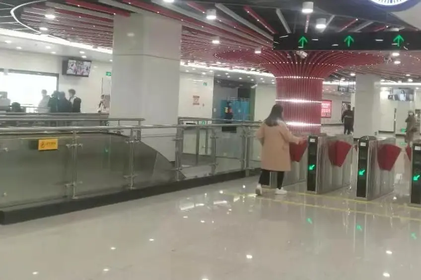 Metro ticket hall with white crystallized glass wall and column surfaces